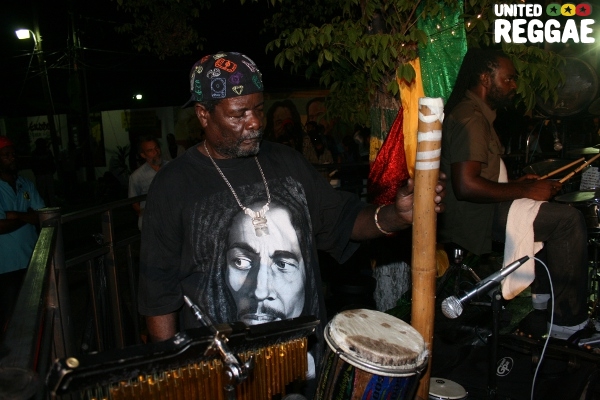 Percussionist Bongo Herman uses a bamboo stick as percussion © Steve James